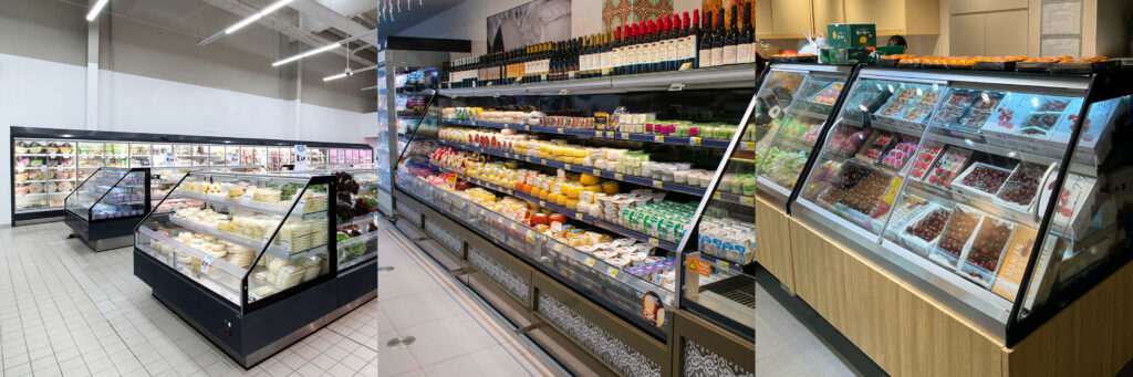 Picture row of semi vertical futuro display case. Pre-packaged aisle of supermarket, wine and cheese self service display, product display case with doors