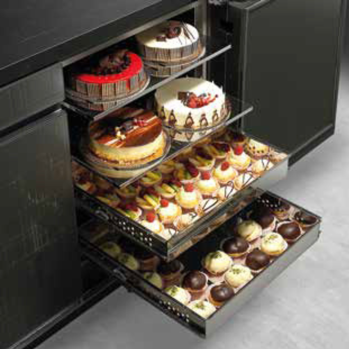 Stainless Steel Backbar with opening drawers showing (top to bottom) cakes and pastry